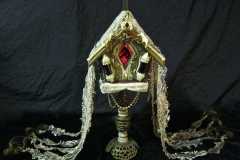 “The Sickness” - 2014 - Mixed media, including menstrual blood and human hair, on a birdhouse with LED light and switch - 20 1/2” x 9” x 6” - Available - Message for details