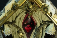 “The Sickness” detail - 2014 - Mixed media, including menstrual blood and human hair, on a birdhouse with LED light and switch - 20 1/2” x 9” x 6” - Available - Message for details