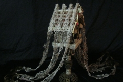 “The Sickness” side view - 2014 - Mixed media, including menstrual blood and human hair, on a birdhouse with LED light and switch - 20 1/2” x 9” x 6” - Available - Message for details
